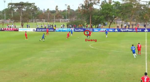 Dwang curves his pressing run with a closed body orientation, immediately engaging the ball carrier on loss of possession to delay progression and force play away from central lanes